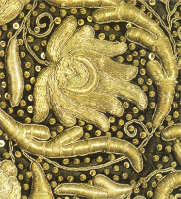 Gold embroidery worked with gold and silver threads and metal spangles. Part of a shoulder-piece. Late 17th century