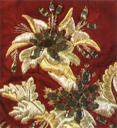 Gold embroidery worked with gold and silver threads and glass spangles on crimson velvet. Detail of a chasuble. Late 18th century