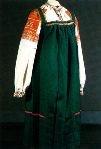 Embroidery worked with red cotton thread in cross stitch on linen and red calico. Female dress. Late 19th century